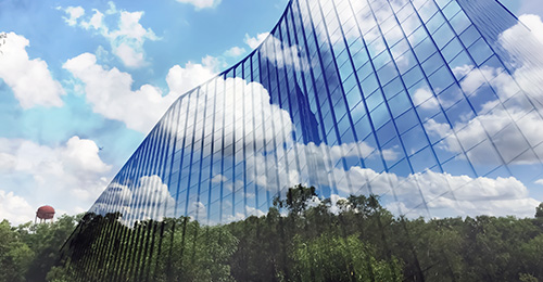 Architects 2 sustainable building with a blue sky and trees